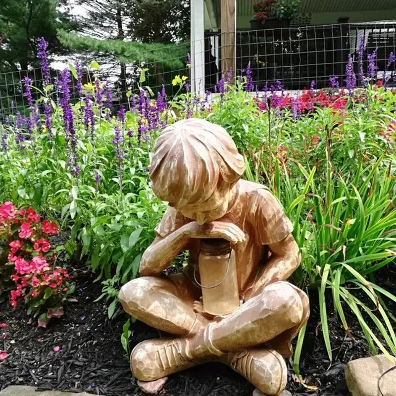 Brown natural resin tabletop ornament with little boy design from The Boy In The Garden