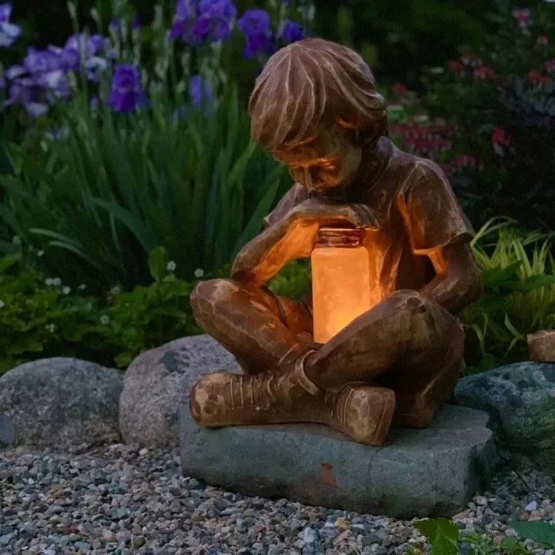 Brown natural resin tabletop ornament with little boy design from The Boy In The Garden