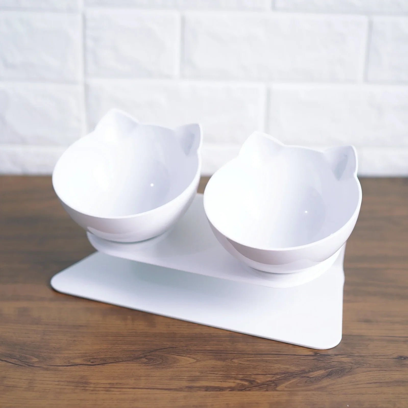 Transparent plastic double bowl for cats with separate food and water compartments