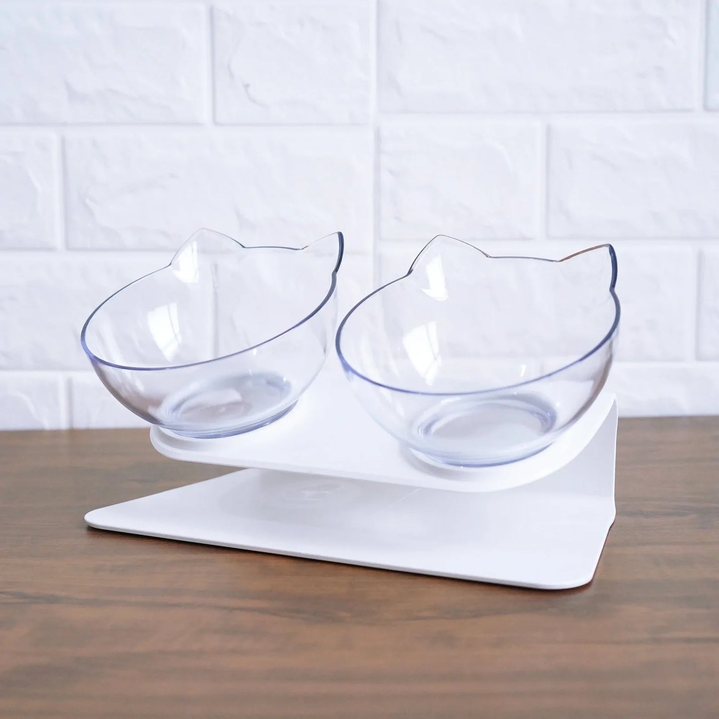 Transparent plastic double bowl for cats with separate food and water compartments