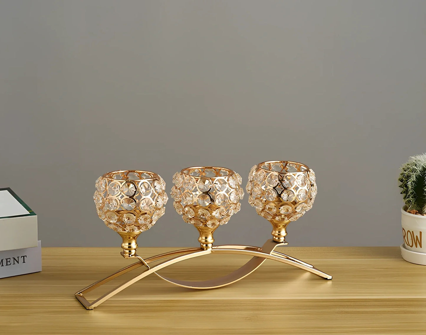 Geometric wrought iron candle holder with crystal centre in gold or silver electroplated finish