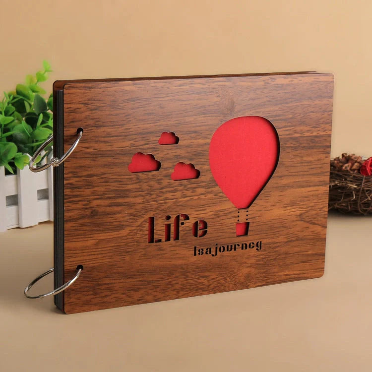 Handmade wooden photo album with customizable loose-leaf pages, 18 unique designs available