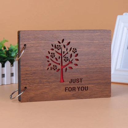 Handmade wooden photo album with customizable loose-leaf pages, 18 unique designs available