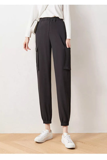 Women's elastic high waist cargo pants in black with multiple pockets