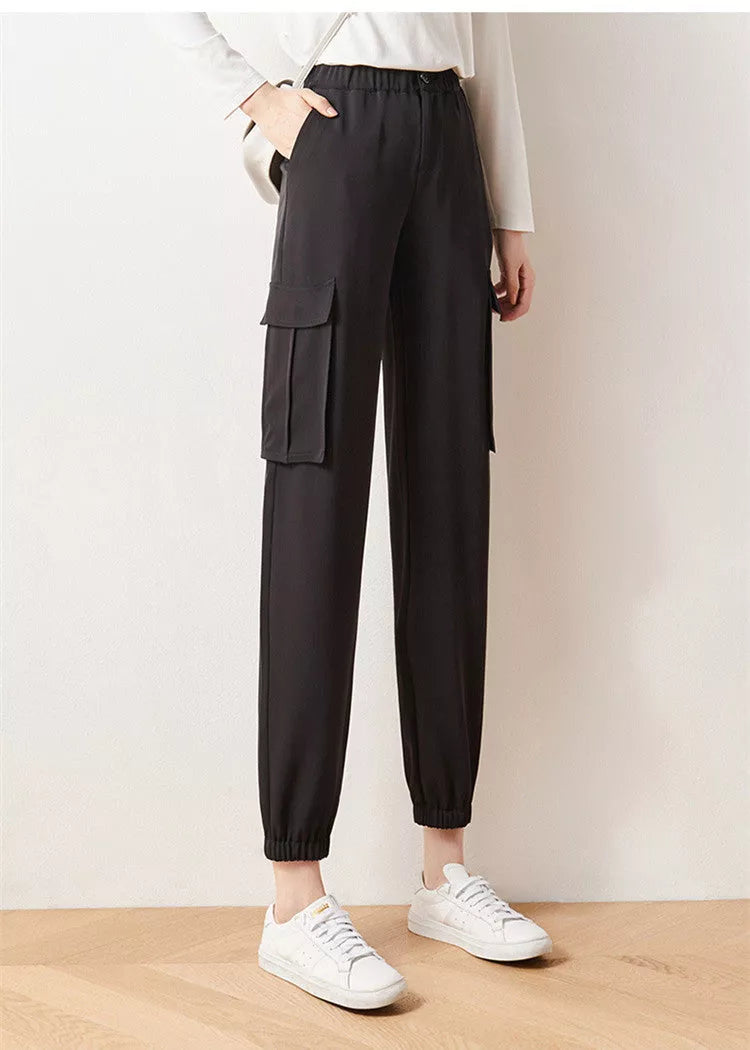 Women's elastic high waist cargo pants in black with multiple pockets