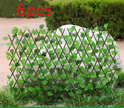 Plastic simulation wooden fence panel showing realistic wood grain texture in outdoor setting