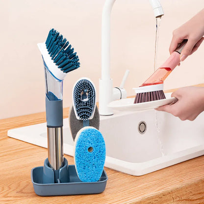 Long-handled kitchen cleaning brush with a soap dispenser button and a blue sponge head
