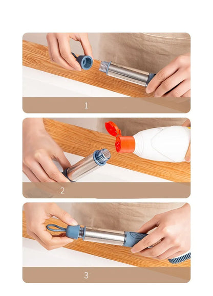 Long-handled kitchen cleaning brush with a soap dispenser button and a blue sponge head