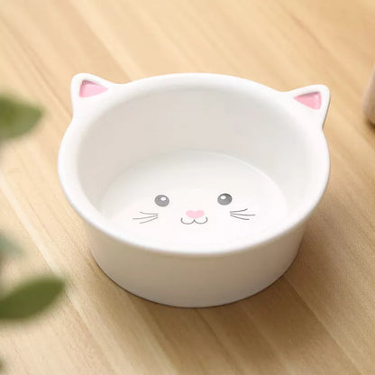 Ceramic pet food bowl with cat face design, easy to clean porcelain material