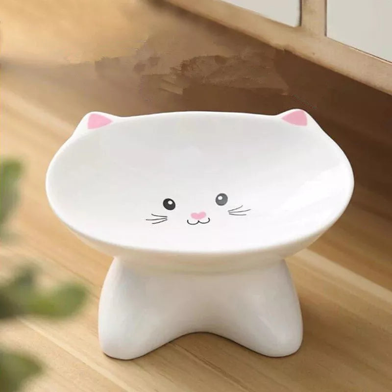 Ceramic pet food bowl with cat face design, easy to clean porcelain material