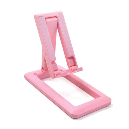 Retractable folding mobile phone stand in an adjusted position on a desktop, shown in one of four colour options.