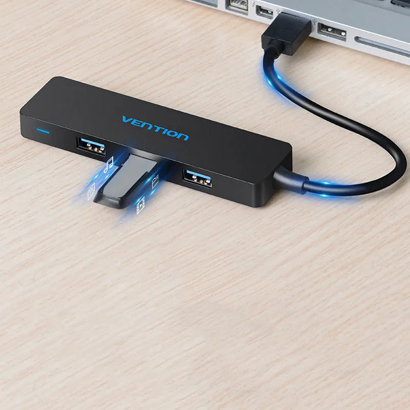 Black Wei Xun four-port USB 3.0 hub with short cable and nickel-plated interfaces