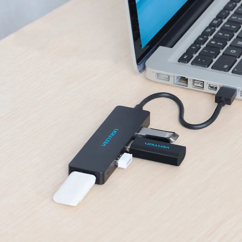 Black Wei Xun four-port USB 3.0 hub with short cable and nickel-plated interfaces