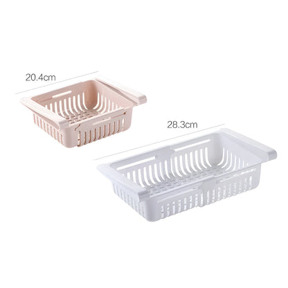 Plastic telescopic refrigerator storage basket in apricot colour, showing multiple compartments for organisation.