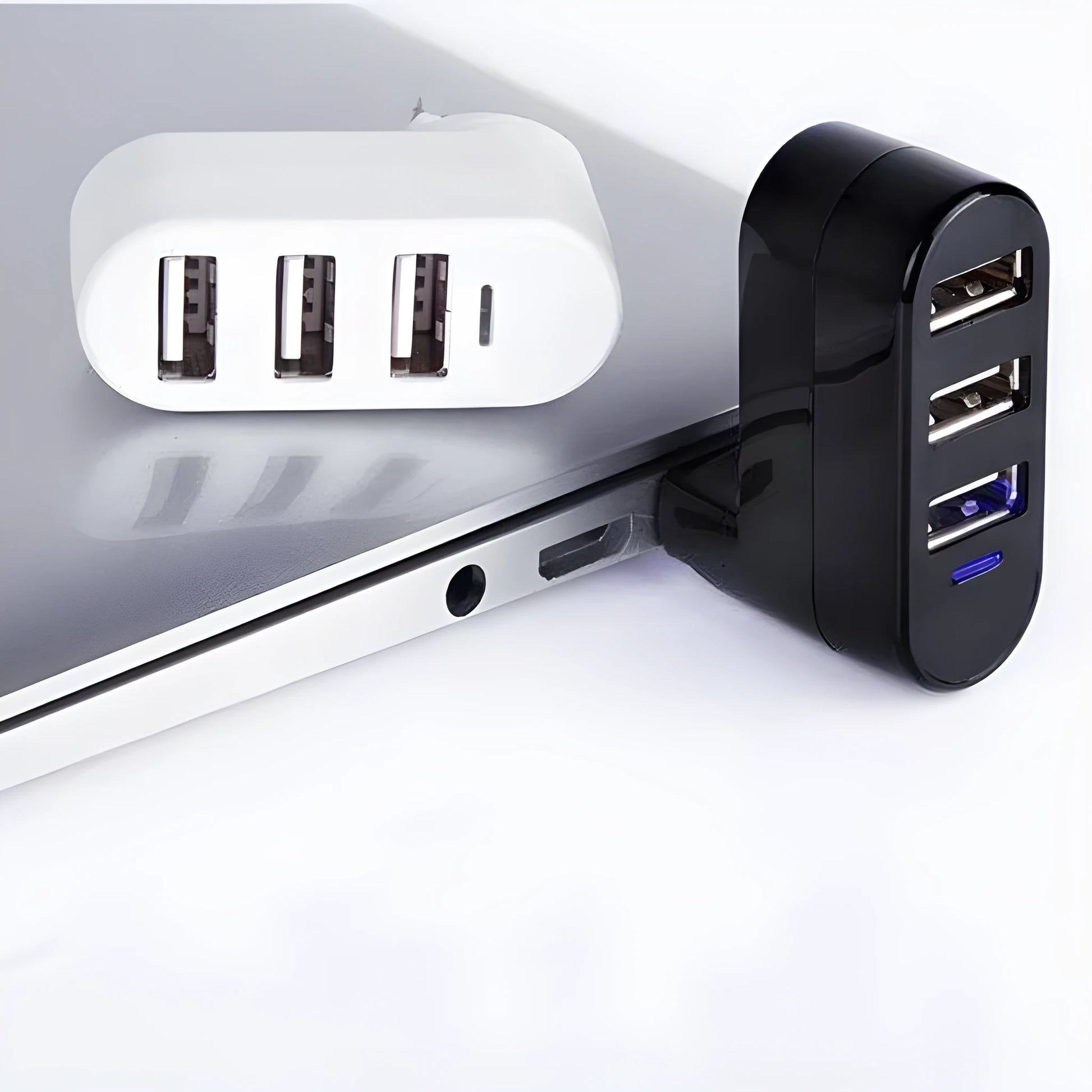 A black and a white USB 2.0 hub splitter with multiple ports.
