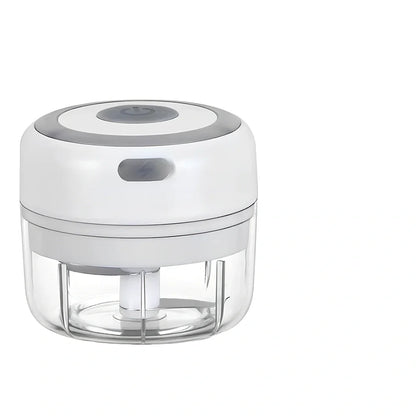 Mini electric garlic chopper with stainless steel blades in green, pink, or white with USB charging cable