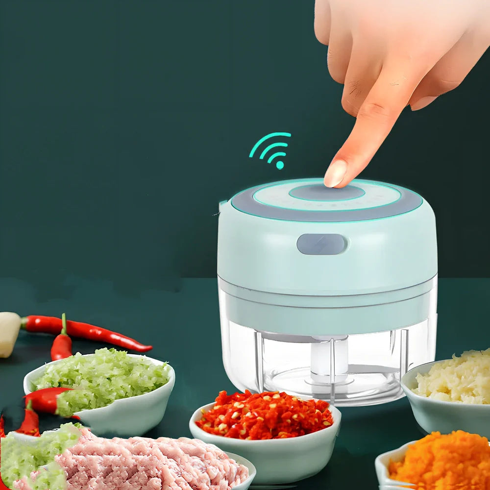 Mini electric garlic chopper with stainless steel blades in green, pink, or white with USB charging cable