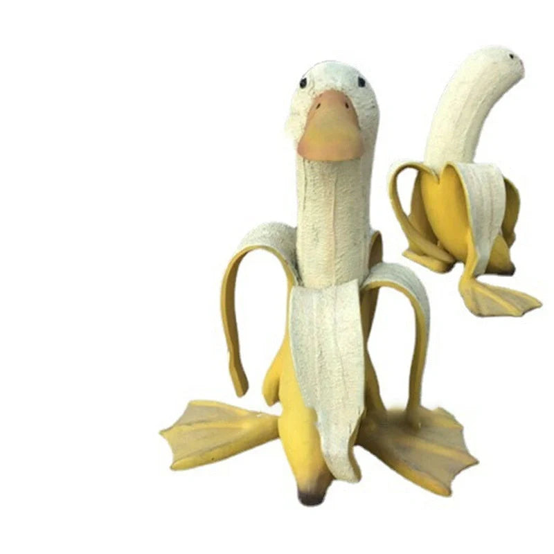 Banana Duck resin garden statue with vibrant yellow color and cartoon design