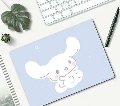 Cartoon character computer mouse pad with rubber base, showing sample designs like Doraemon and Pikachu.