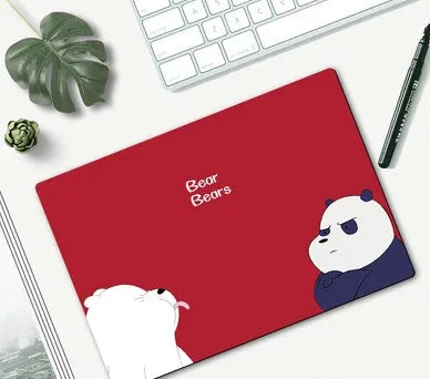 Cartoon character computer mouse pad with rubber base, showing sample designs like Doraemon and Pikachu.