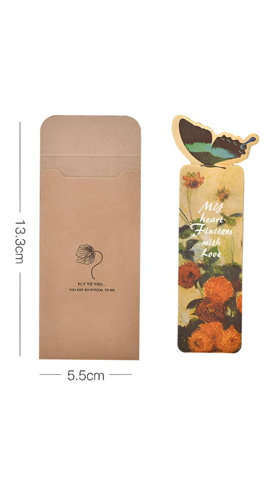 Decorative butterfly-shaped paper bookmark with colourful design, measuring 13.5cm by 5.5cm.