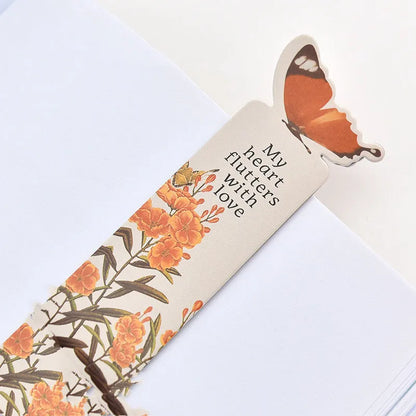 Decorative butterfly-shaped paper bookmark with colourful design, measuring 13.5cm by 5.5cm.