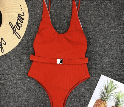 Women's one-piece swimsuit in solid colour polyester with belt buckle, tight fit, available in six colours and sizes S M L