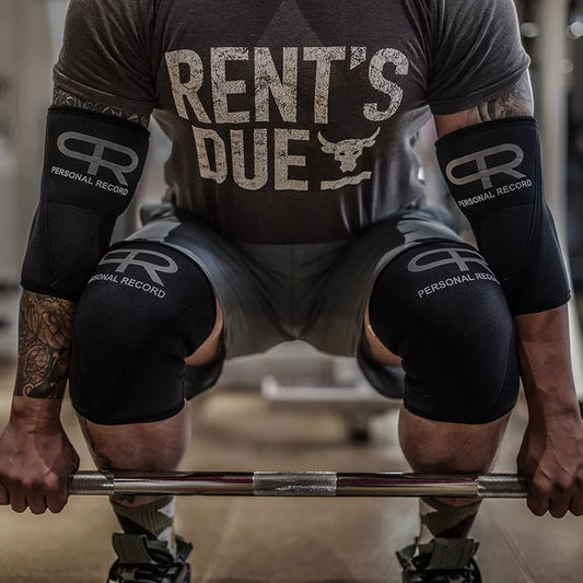 Professional black weightlifting knee pads for squats, available in sizes S to XL.