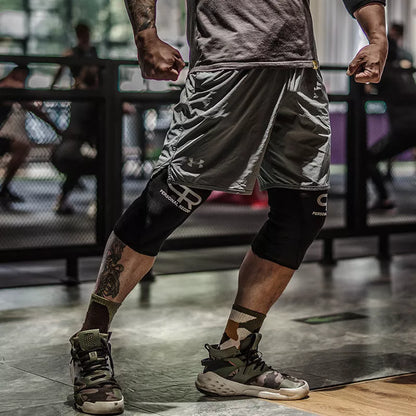 Professional black weightlifting knee pads for squats, available in sizes S to XL.