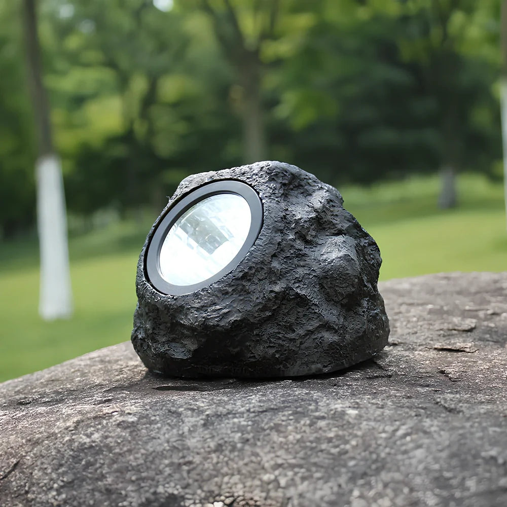 Solar courtyard lamp with simulation stone design and LED illumination for outdoor gardens