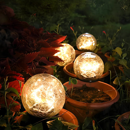Cracked glass ball LED solar light, 10cm size with warm white glow for garden paths, waterproof and ground stake included