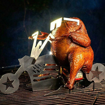 Steel motorcycle-shaped chicken roasting rack holding upright chicken with beer can on barbecue grill