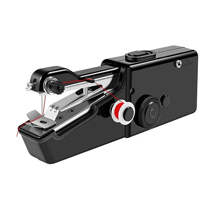 Black handheld electric sewing machine with ruler, scissors, and thread coils on white background