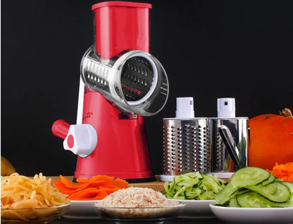 Round mandoline vegetable slicer with three stainless steel blades and a rubber suction base, in blue green colour.