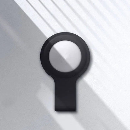 Soft, silicone AirTag holder in black and pink colors, providing protection and personalization for Apple tracking devices