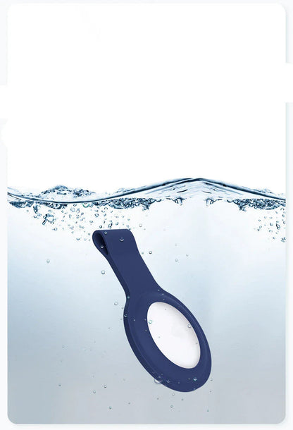 Soft, silicone AirTag holder in black and pink colors, providing protection and personalization for Apple tracking devices