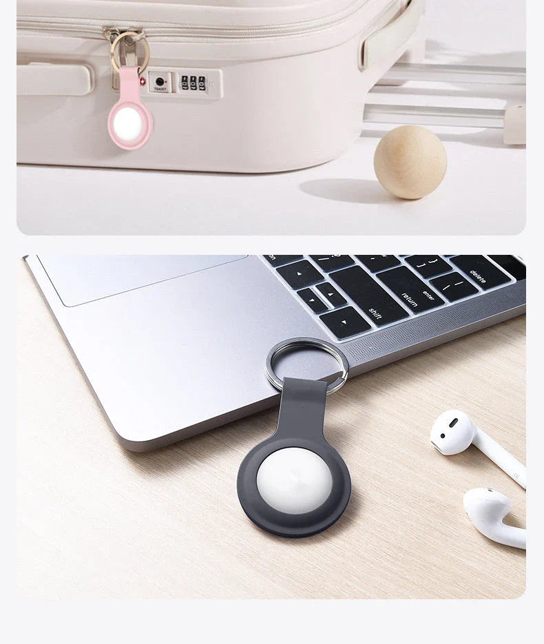Soft, silicone AirTag holder in black and pink colors, providing protection and personalization for Apple tracking devices