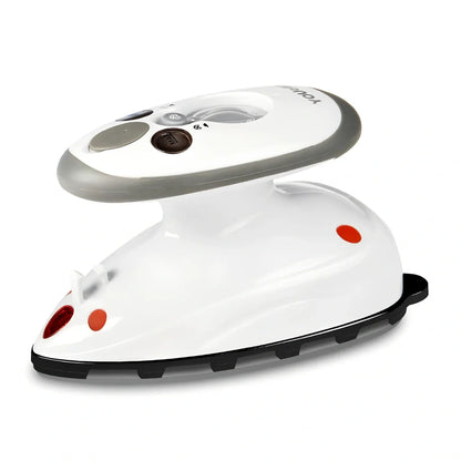 Red mini electric travel iron with ceramic soleplate showing temperature dial and compact design