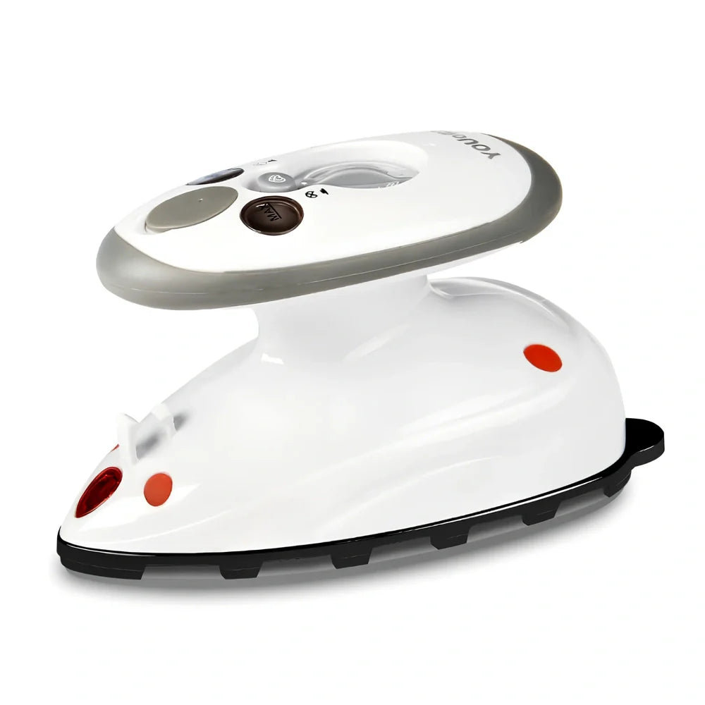 Red mini electric travel iron with ceramic soleplate showing temperature dial and compact design