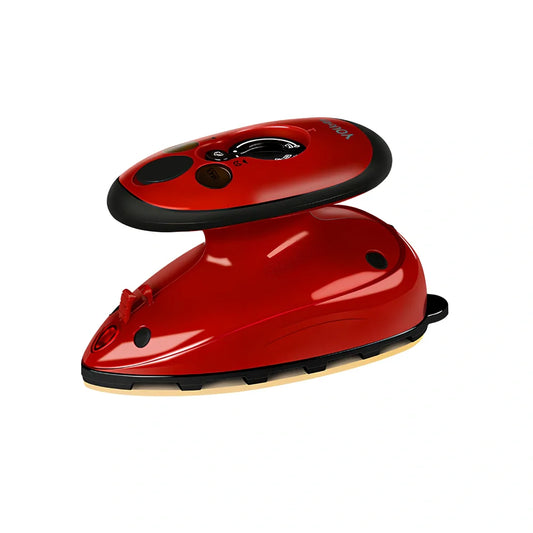 Red mini electric travel iron with ceramic soleplate showing temperature dial and compact design