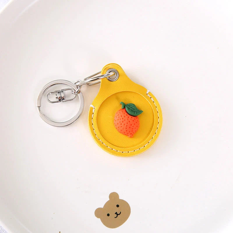 Fruit-themed silicone protective case for Apple AirTag with keychain