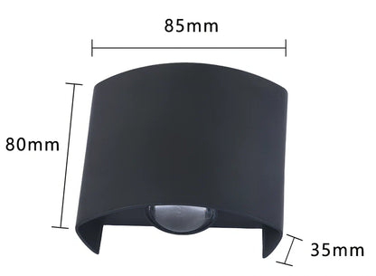 Black outdoor LED wall lamp with aluminium shell mounted on a wall, showing compact design and rainproof IP65 rating