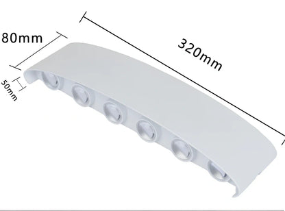 Black outdoor LED wall lamp with aluminium shell mounted on a wall, showing compact design and rainproof IP65 rating