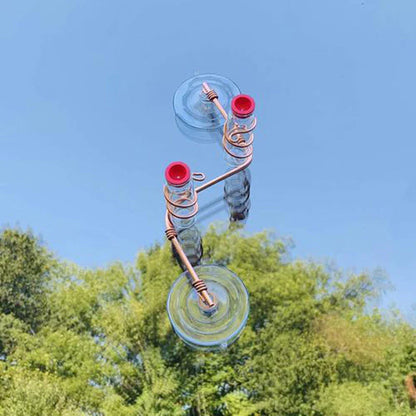 Decorative copper wire hummingbird feeder with transparent PET bottles and suction cup for easy installation in gardens, decks, or patios