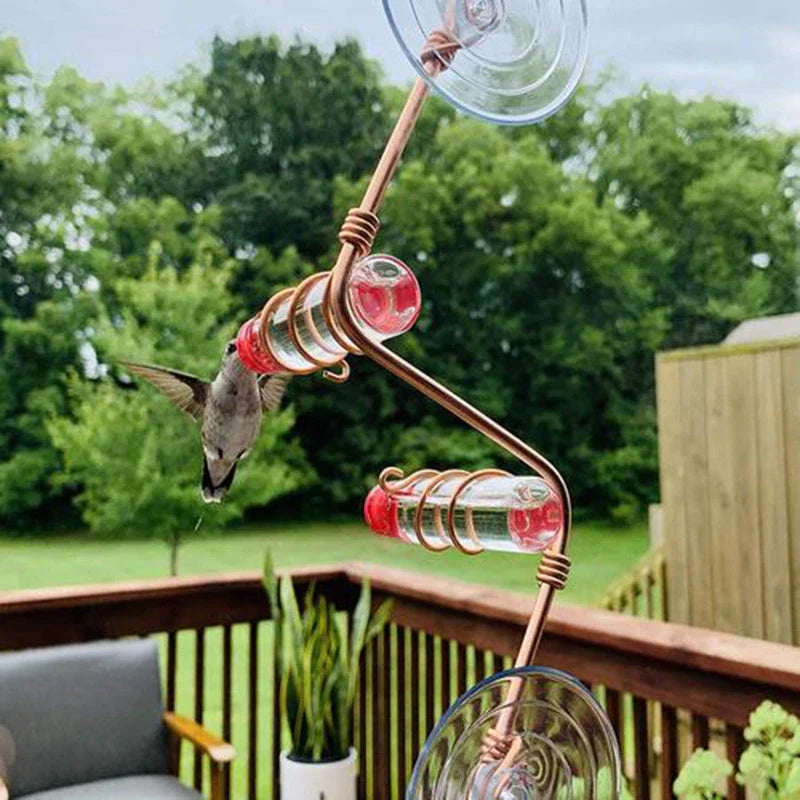 Decorative copper wire hummingbird feeder with transparent PET bottles and suction cup for easy installation in gardens, decks, or patios