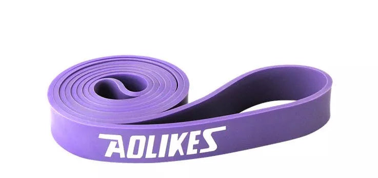 Natural latex resistance band for yoga and fitness training in various resistance levels.