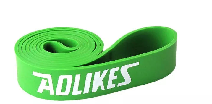 Natural latex resistance band for yoga and fitness training in various resistance levels.