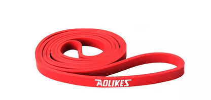 Natural latex resistance band for yoga and fitness training in various resistance levels.