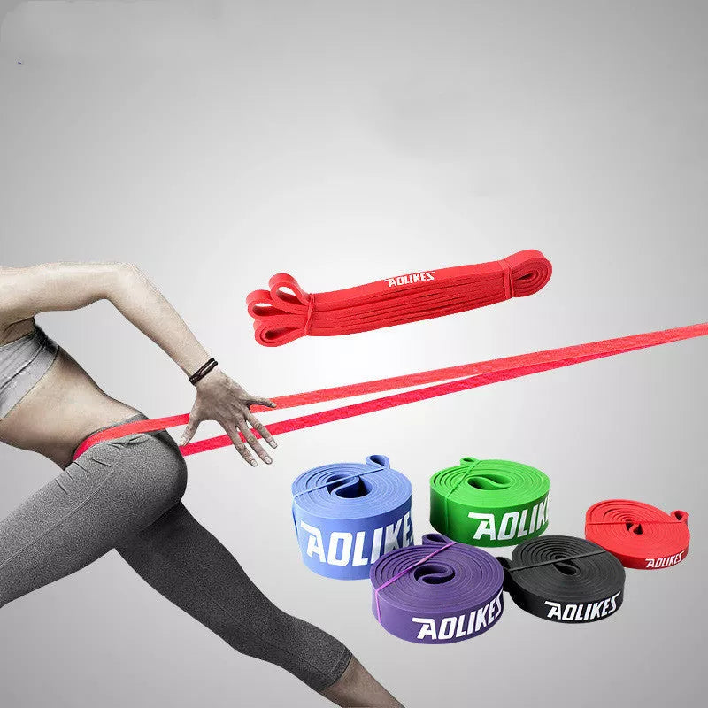 Natural latex resistance band for yoga and fitness training in various resistance levels.