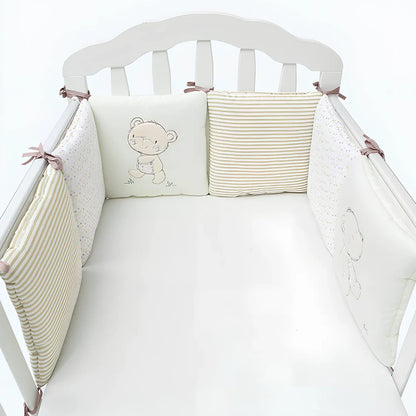 Six 30cm square cotton baby bedding panels with animal patterns surrounding white cot